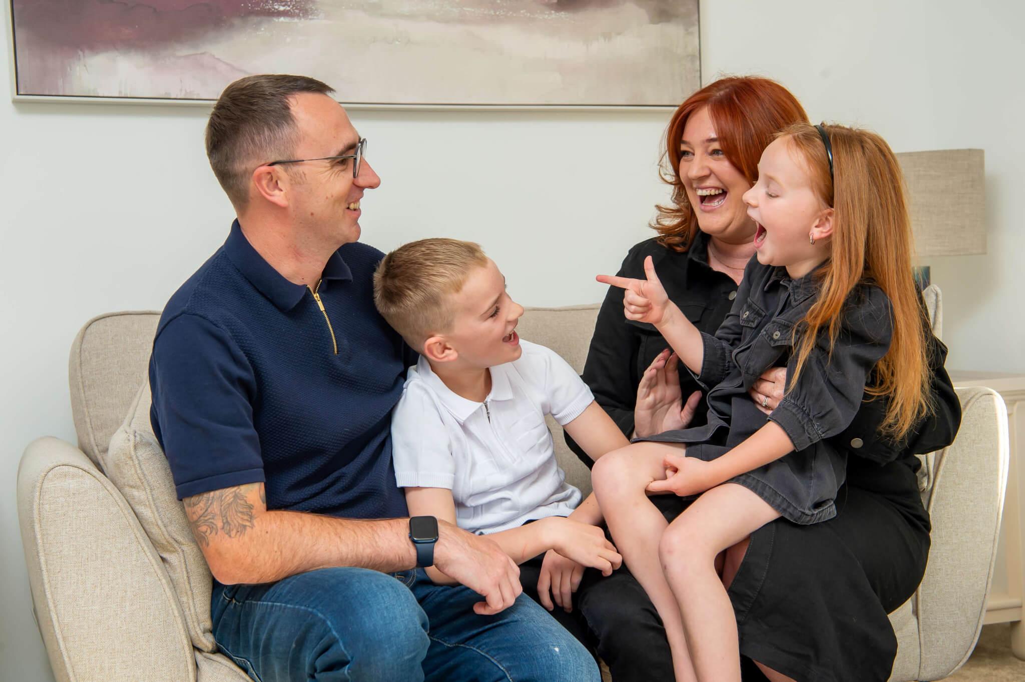 Eleanor, Kevin and children on sofa